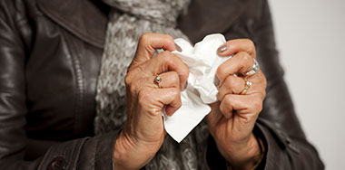Woman holding a tissue