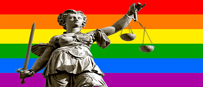 A symbol of justice with rainbow colors in the background