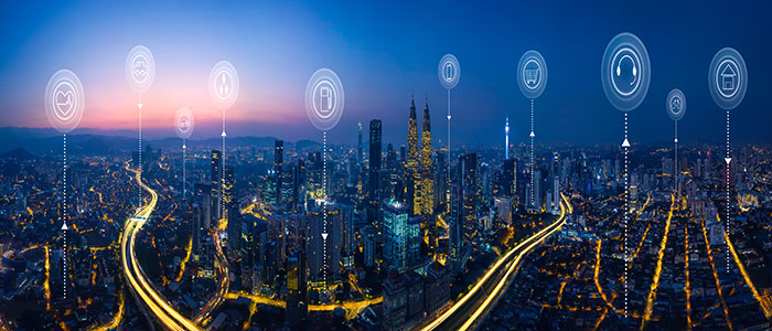 Panorama aerial view of a cityscape with icons representing smart city interconnected